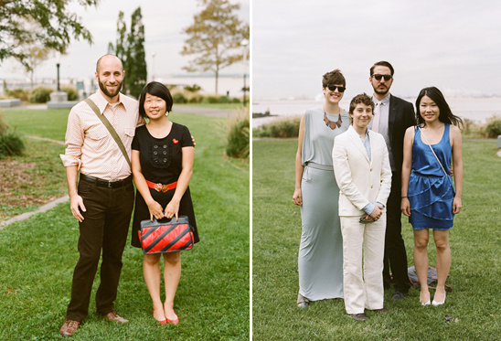 Two groups of stylish wedding guests pose on a lawn