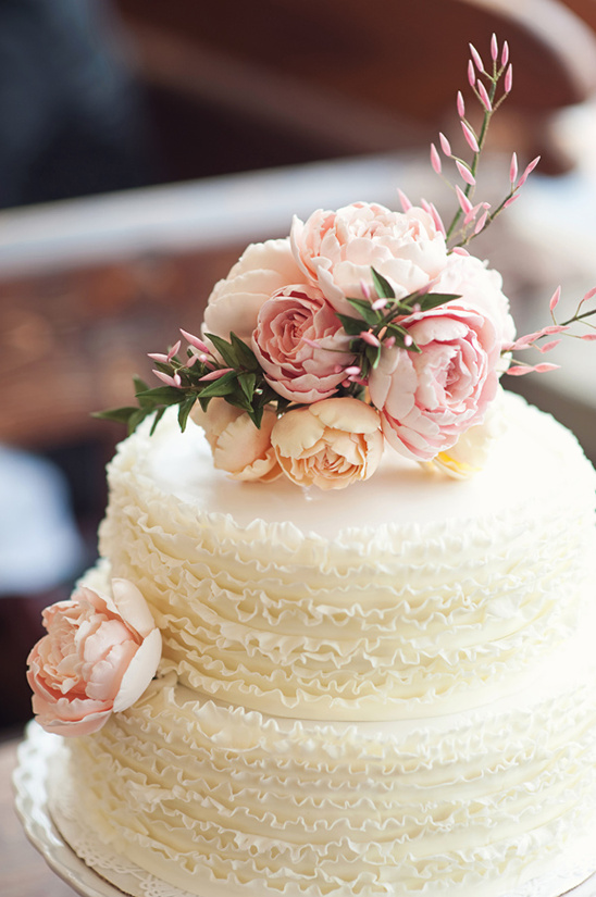 Elegant two tiered wedding cake with pink flowers