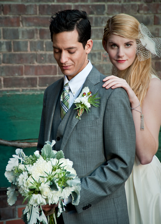Groom and bride in stylish wedding attire