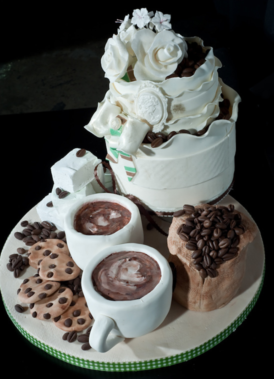 Elegant coffee-themed cake with cookies and cocoa