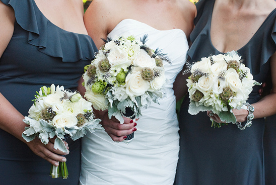 Bride and bridesmaids holding flower bouquets wedding