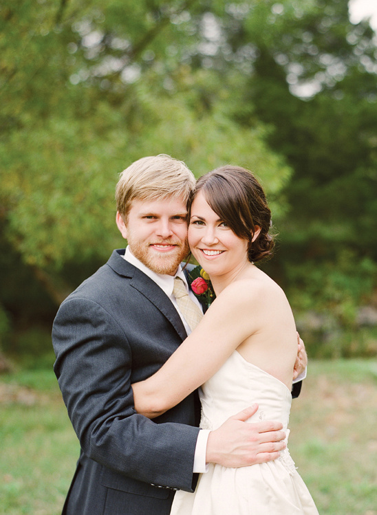 Happy bride and groom embracing on wedding day