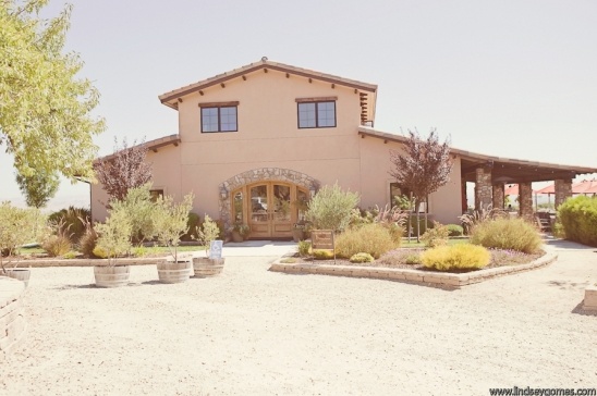Tan winery building with landscaping