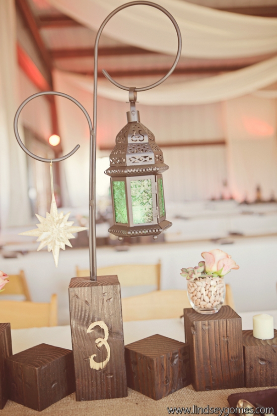 Rustic lantern table centerpiece at wedding reception