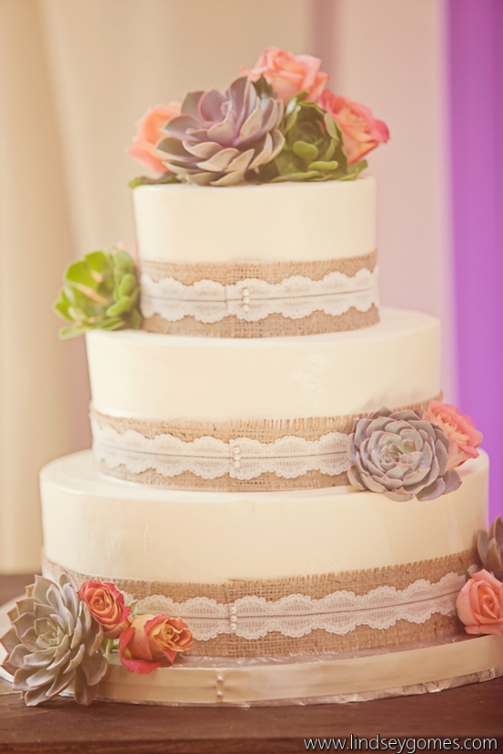 Elegant wedding cake decorated with burlap lace and succulents