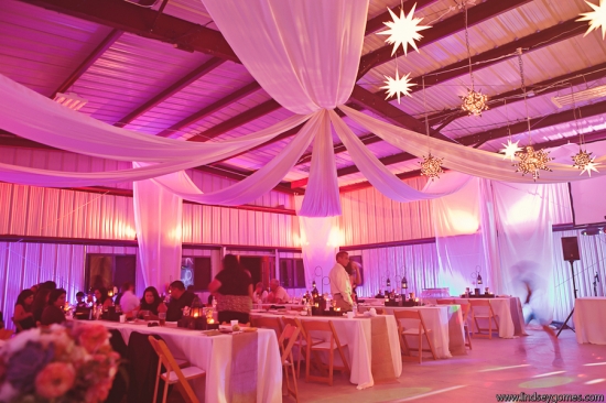 Elegant wedding reception venue with star lights and drapery