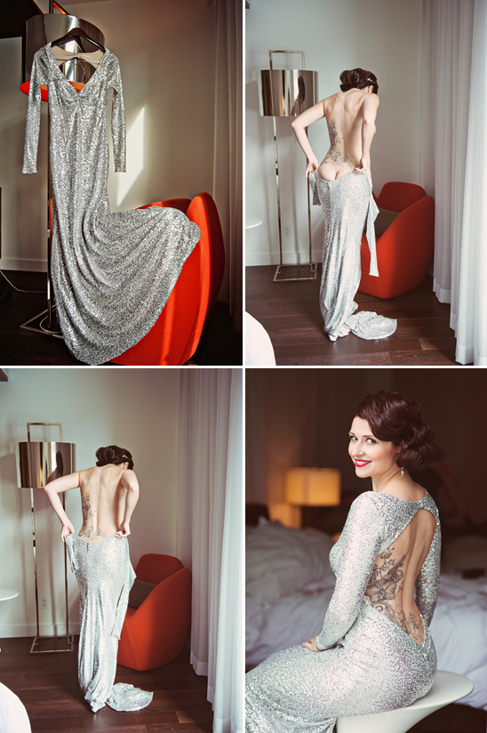 Woman gets ready wearing long sleeved silver gown