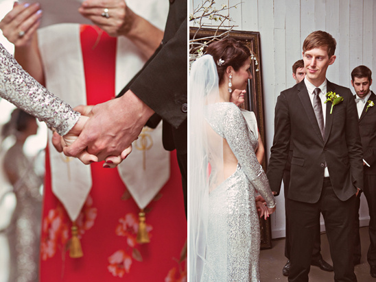 Newlyweds hold hands during their wedding ceremony