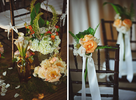 Floral arrangements decorate wedding chairs