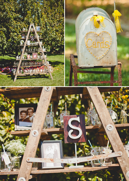 Rustic wedding decor: ladder, photos, cards, mason jars