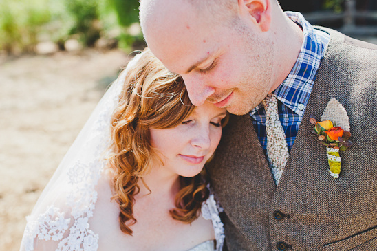 Bride and groom share a tender moment on their wedding day