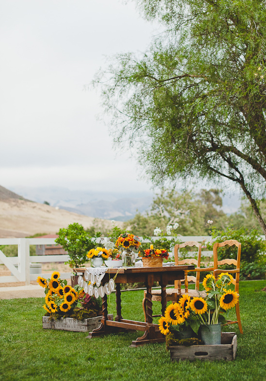 Rustic outdoor wedding table with sunflowers