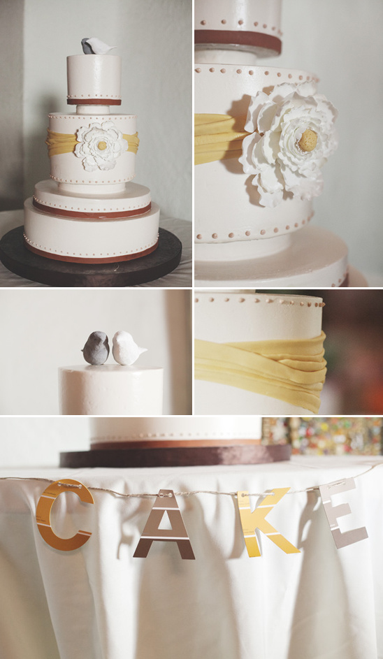 Elegant wedding cake with yellow ribbons and decorations