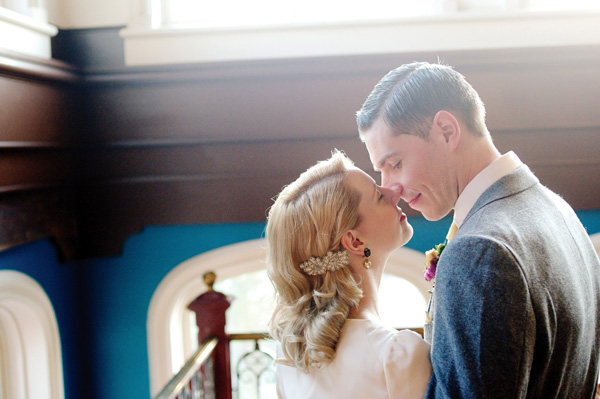 Elegant bride and groom share a tender kiss