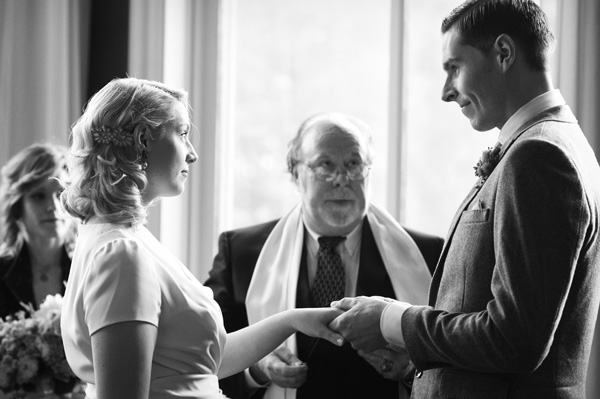 Couple exchanging rings at wedding ceremony
