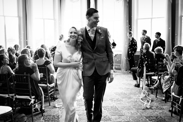 Couple walking down aisle wedding ceremony