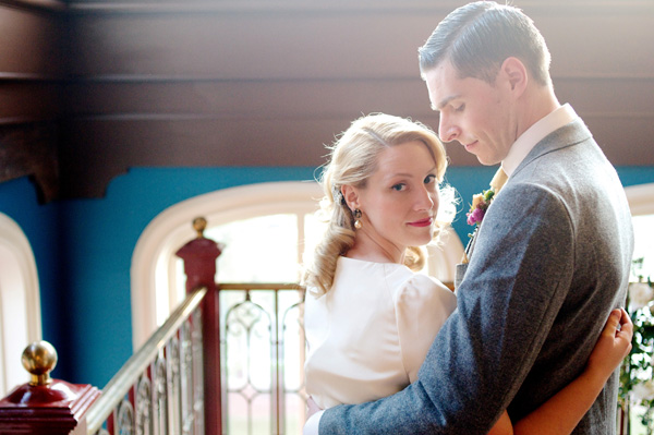 Couple embracing in vintage wedding attire