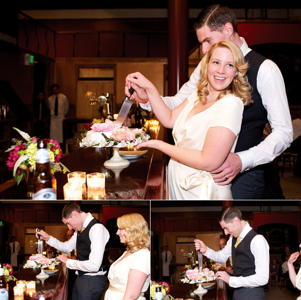 Bride and groom cut flower adorned cake at wedding bar
