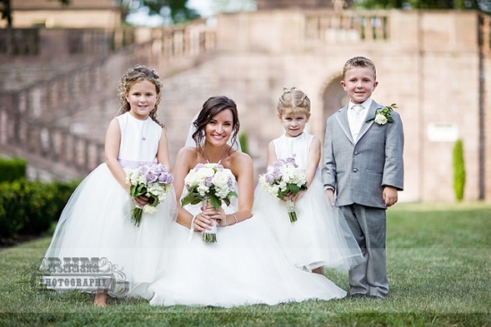 Bride with flower girls and ring bearer at wedding