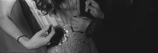 Woman adjusting beaded flapper dress