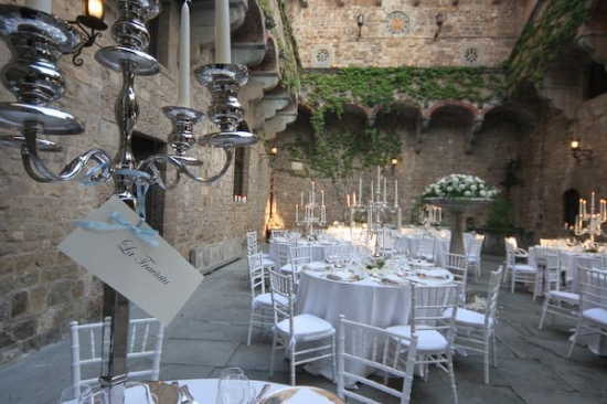 Elegant castle courtyard wedding reception decor