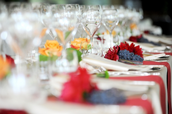 Elegantly decorated table setting with flowers and grapes