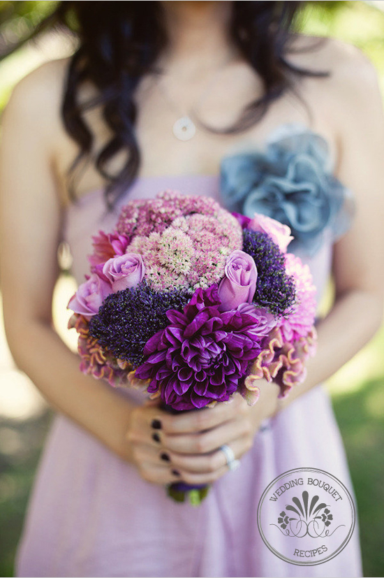 Purple and pink wedding bouquet held by bride