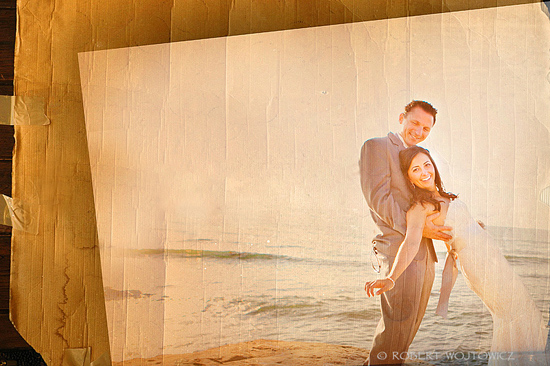 Happy couple embraces on beach at sunset