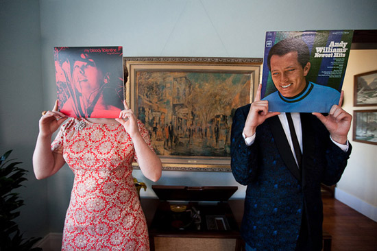 Sixties engagement session. Couple with records at home