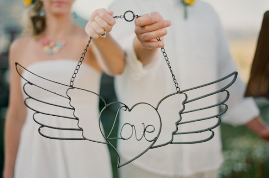Metal heart with wings, love sign