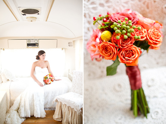 Bride in vintage trailer with bright rose bouquet