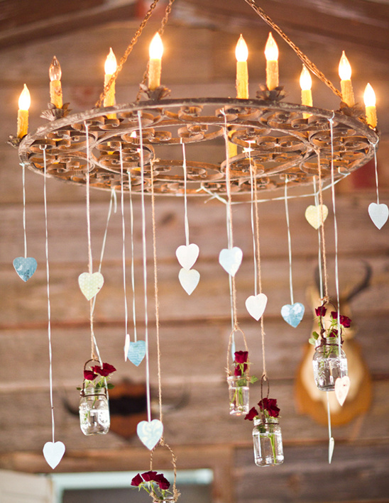 Rustic chandelier with heart decorations and floral jars