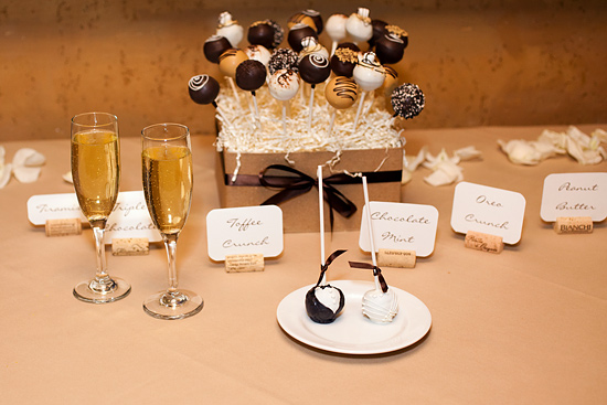 Champagne and gourmet cake pops dessert table display