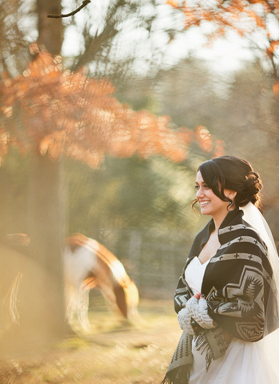 Bride in patterned shawl, outdoors