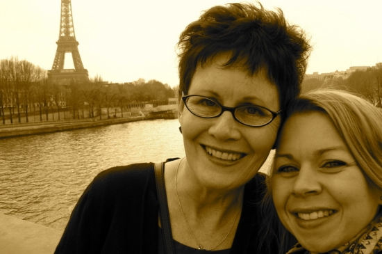 Women smiling near Eiffel Tower Paris vacation photo