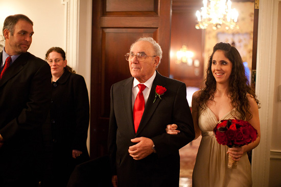 Father leading daughter at wedding