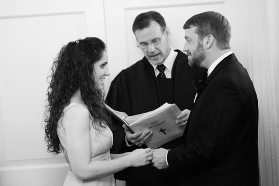 Couple exchanging rings in wedding ceremony
