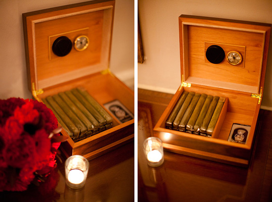 Open wooden humidor box filled with cigars