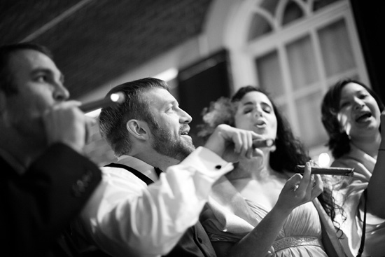 Friends enjoy cigars at a party in black and white style
