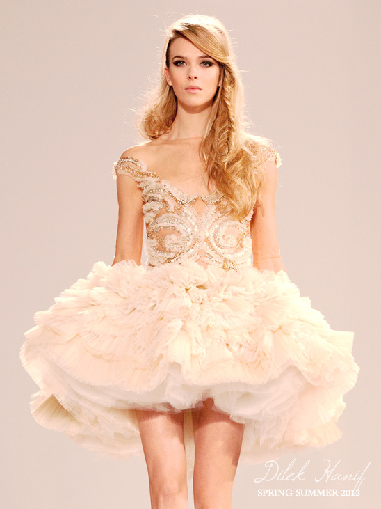 Dilek Hanif model in a ruffled mini dress on the runway
