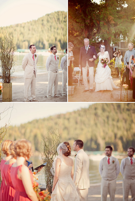 Lake wedding ceremony with happy couple and guests