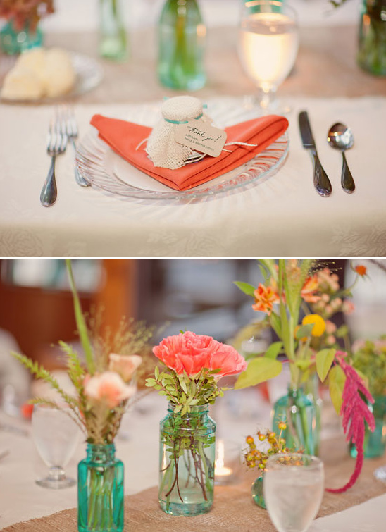 Elegant wedding table setting with coral and turquoise accents