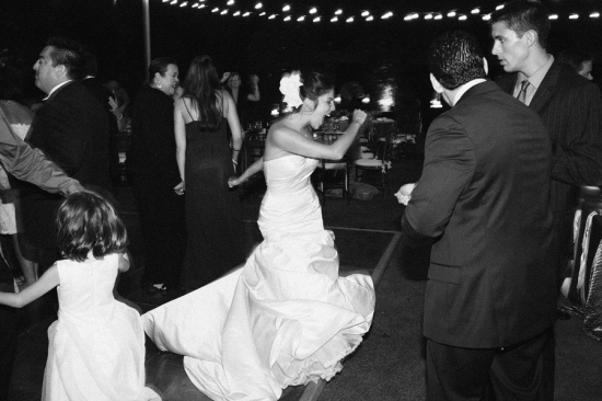 Bride dancing at wedding reception black and white