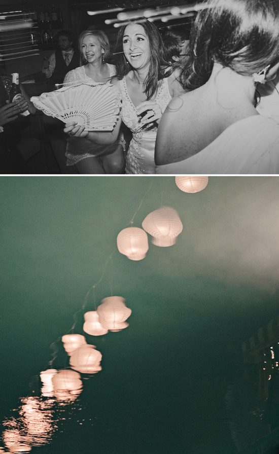 Happy wedding party dancing with fans
