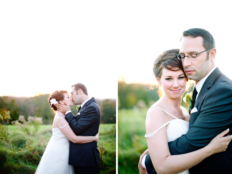 Bride and groom kissing and embracing outdoors