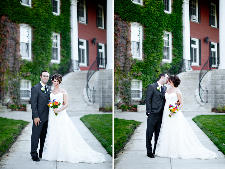 Bride and groom at a wedding in front of ivy building