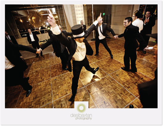Guests joyfully dance at wedding reception