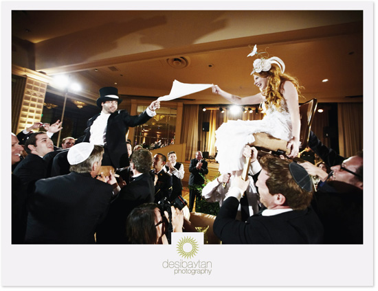 Jewish wedding: bride and groom chair lift celebration