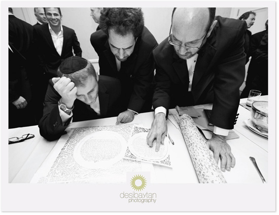 Groom signing Ketubah;  Jewish wedding ceremony