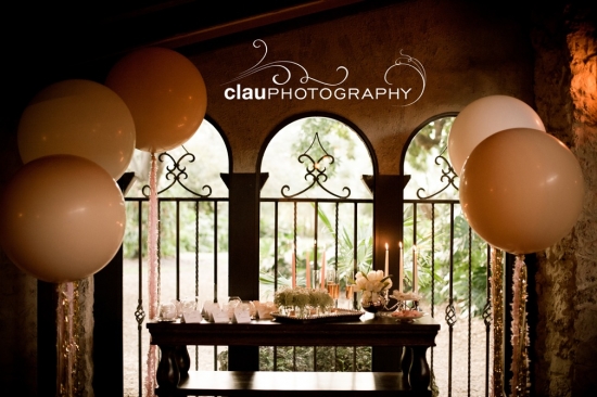 Wedding reception table with balloons and champagne